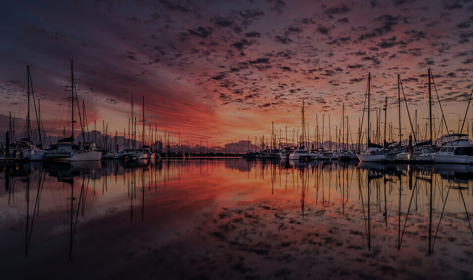 Graphic showing a harbour at sunset