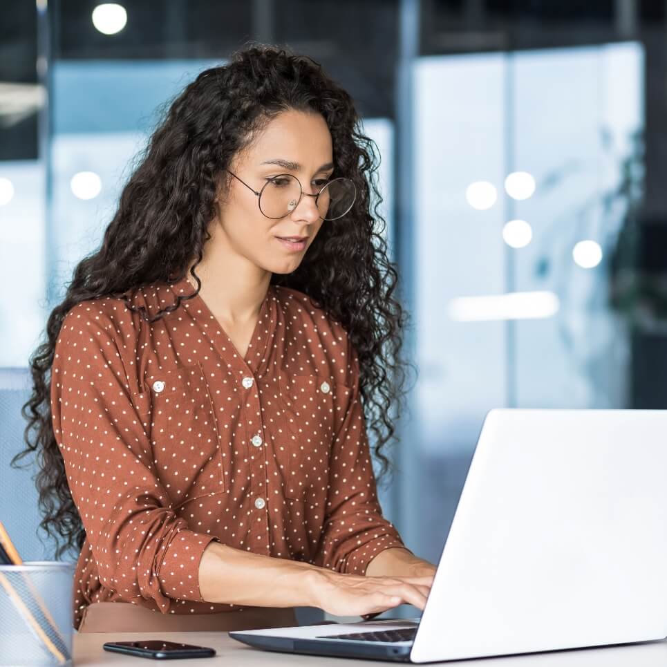 Image showing a developer working on her laptop