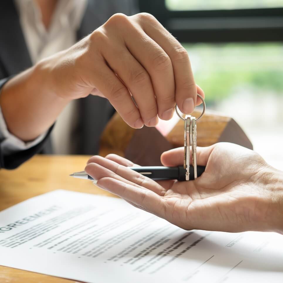 Image showing a close up of a set of keys being handed over