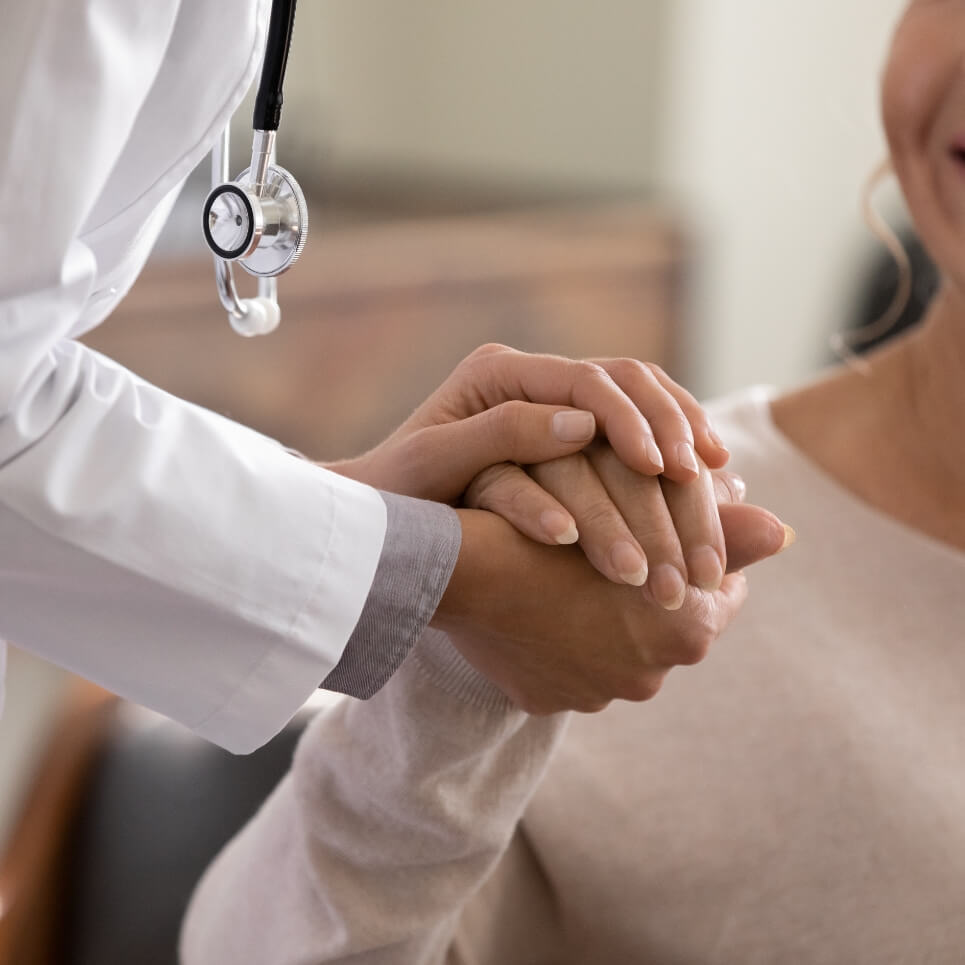 Image showing a close up of a doctor holding a patient's hand