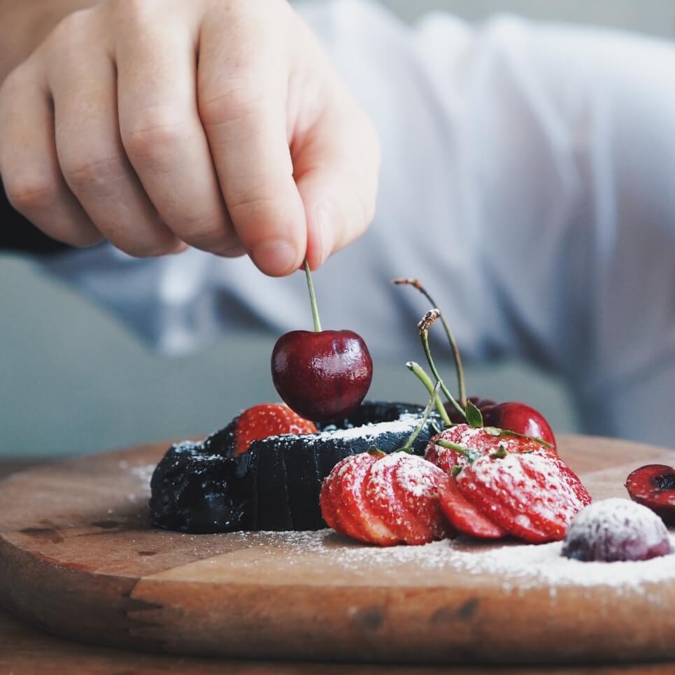 Image showing a chef putting the finishing touches to a dish