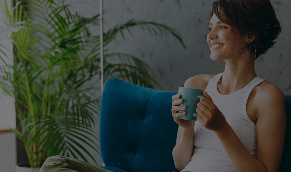 Image showing a smiling woman holding a mug