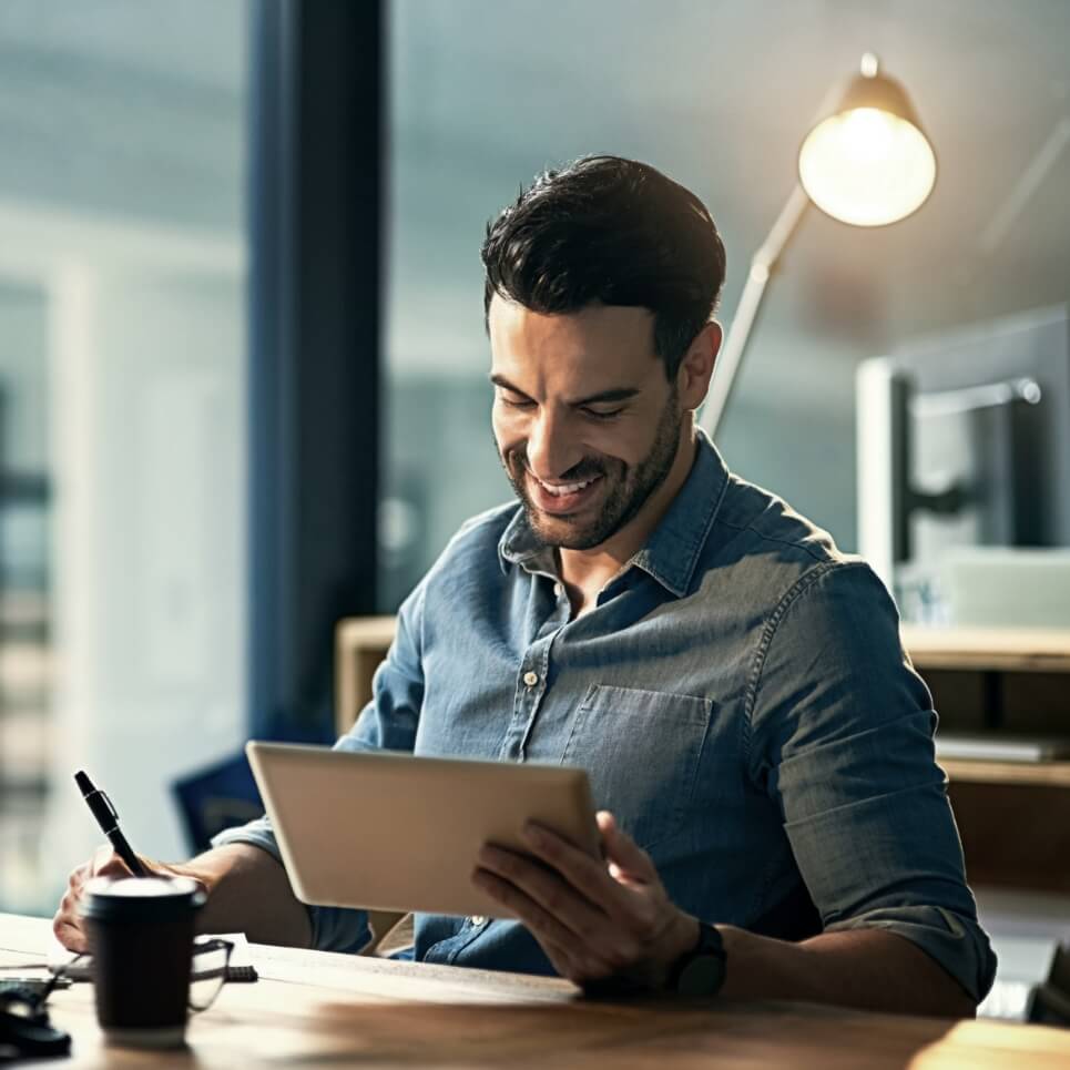 Image showing a man using a tablet