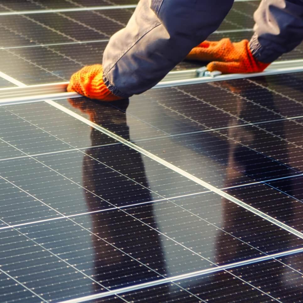 Image showing a contractor installing solar panels