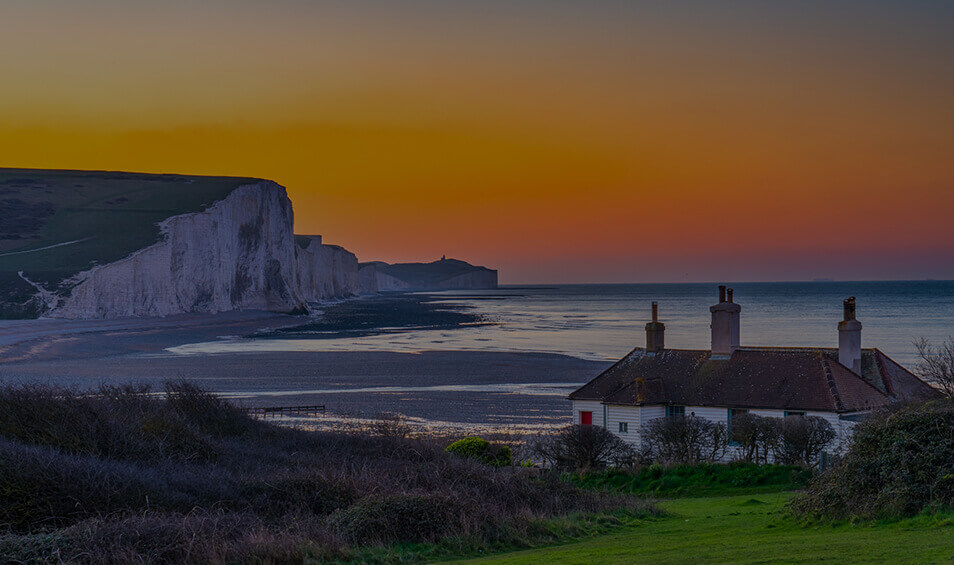 Image of a coastline at sunset