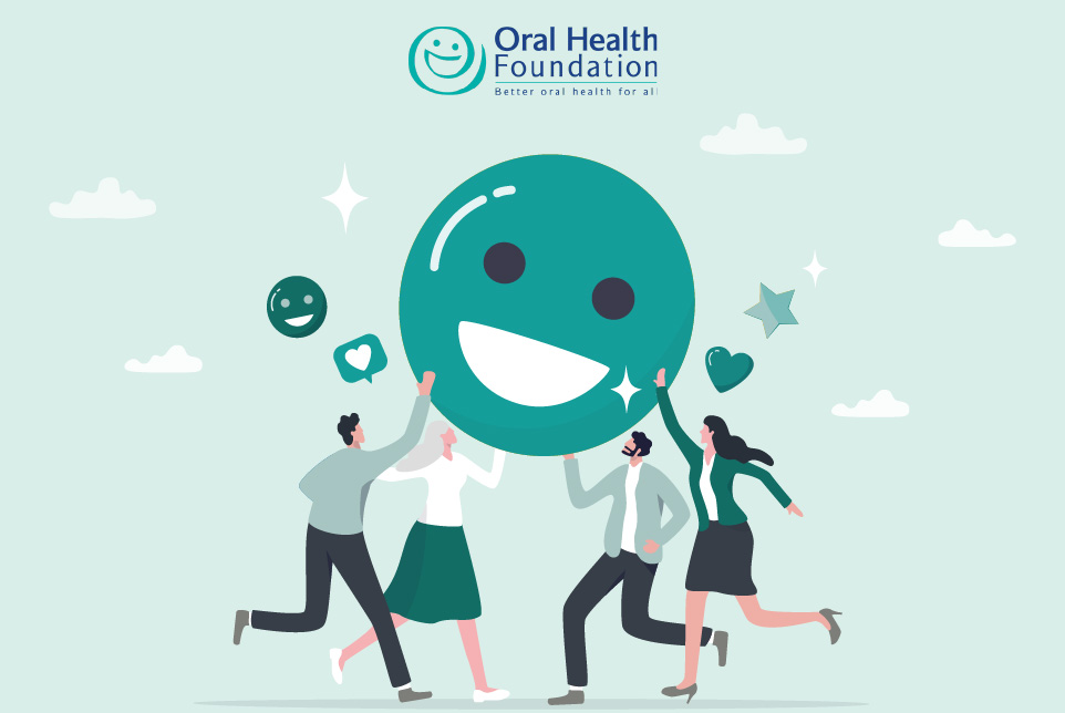 Graphic showing a smile emoji being held up by a group of people