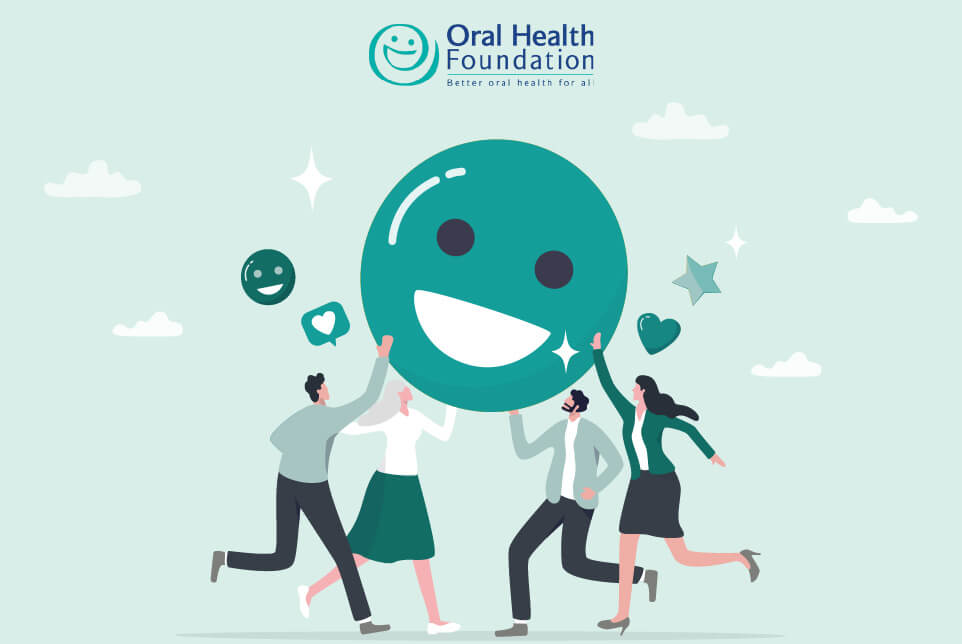 Graphic showing a smile emoji being held up by a group of people